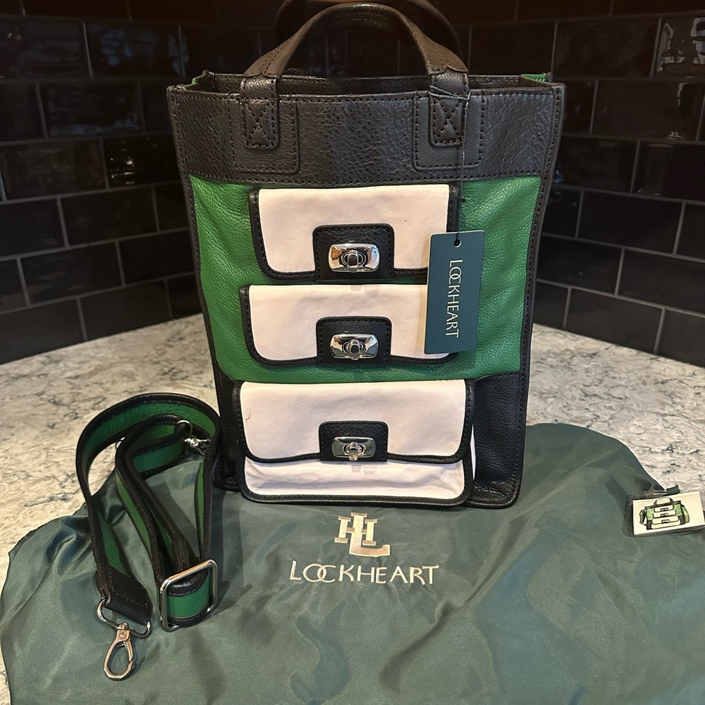 LOCKHEART satchel/Tote made of buttery soft leather and organization galore! NWT